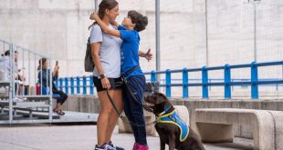 Nieves, with his daughter Lucia and his first assistance dog, Hana.