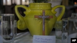 A piece of paper with the name of Jorge Mario Bergoglio in a spiritual offering during a celebration of believers of Santería in Cuba.