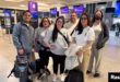 Ana María Haefmeyer, 36, and Adamary 'Ada' García, 40, pose for a photo with other people before boarding a flight to Chile, where they will meet with their biological family, at the George Bush intercontinental airport in Houston in Houston , Texas, on February 21.